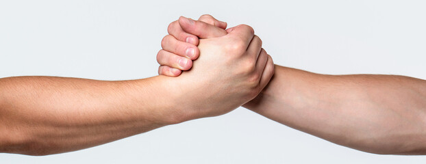 Two hands, helping arm of a friend, teamwork. Helping hand outstretched, isolated arm, salvation....