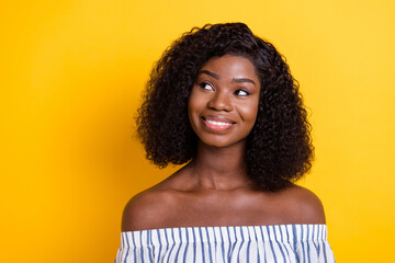 Photo of pretty sweet dark skin lady dressed white clothes looking empty space isolated yellow...