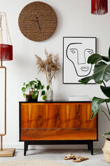 Creative composition of stylish living room inerior design with mock up poster frame, wooden...