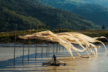 A fisherman hangs giant fishing nets to dry in Xiapu, China's Fujian province
