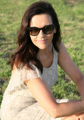 Portrait of a smiling young woman in the evening sun while relaxing in Cyprus