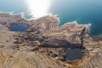 Sinkholes in The Dead Sea coastline, Aerial view.