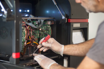 Close up of electrician engineer works with electric cable wires. Installation inspect. Electrical equipment