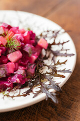 Traditional Finnish beetroot salad with potatoes, apples, carrots and pickles.