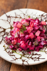 Traditional Finnish beetroot salad with potatoes, apples, carrots and pickles.