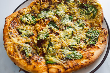 vegan pesto and spinach flatbread with dairy-free cheese, healthy plant-based food