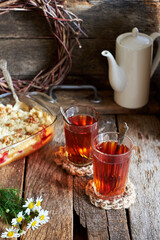 tea in a glass on a wooden table. Side view. Rustic.
