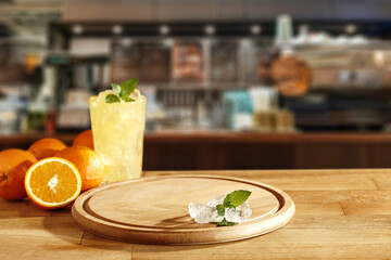Wooden desk of free space and bar interior. Free space for your decoration and fresh orange fruits 
