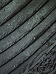 Close-up of the Oseberg Viking ship exterior with bokeh on a portrait lens