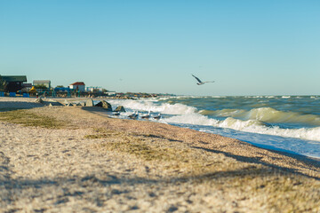 Sand beach line of the stormy sea