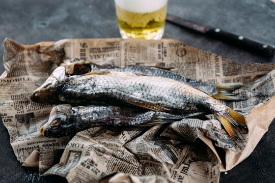 Dried fish on the table close-up. Taranka with beer