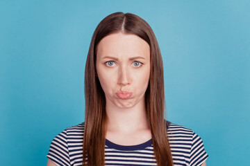 Portrait of pretty cute naughty childish lady sad face pout lips on blue background