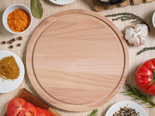 round cutting board with food ingredients for cooking culinary dishes