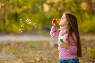 autumn outdoor portrait of beautiful happy child girl