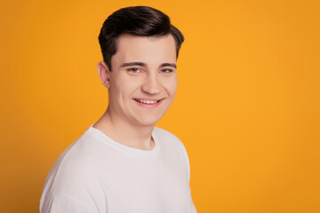 Photo of satisfied guy entrepreneur isolated over yellow background