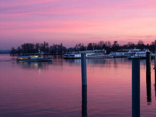 Exciting brightly colored sunset over Lake Maggiore, Arona, Piedmont, Italy.