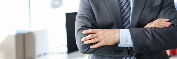 Confident businessman in gray business suit closeup