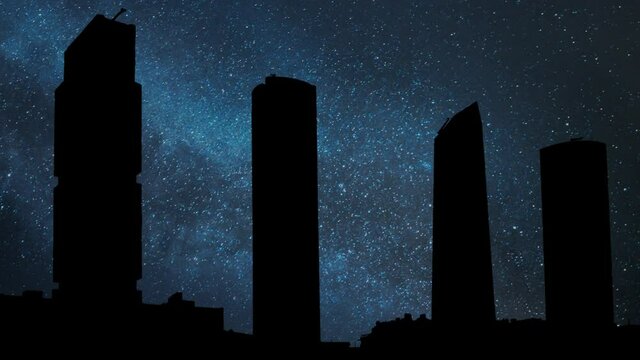 Madrid Skyline By Night, Timelapse with Skyscrapers in Silhouette, Stars and Milky Way in Background
