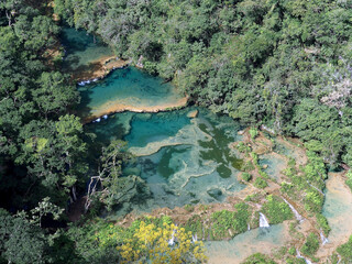 Aerial view of beautiful limestone bridges, natural pools and rainforest at Semuc Champey, Guatemala