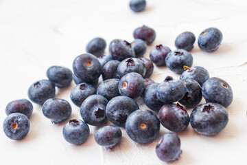 Lots of wet blueberry on white background.
