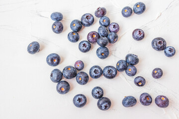 Lots of wet blueberry on white background.