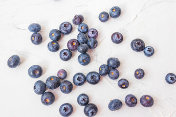 Lots of wet blueberry on white background.