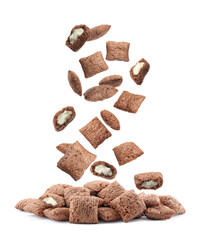 Sweet crispy corn pads falling into pile on white background