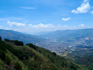 Fototapeta na wymiar Medellin, Colombia - 17.02.2020: Aerial view of Medellin from the hills