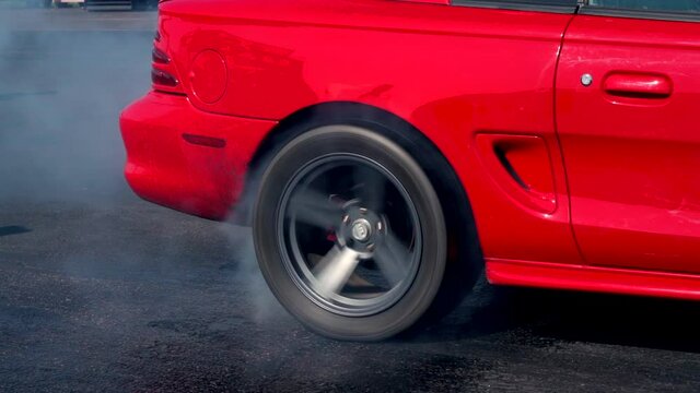 Red car force starts with tyre burnout

