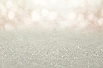 Shiny glitter and blurred lights on background. Bokeh effect