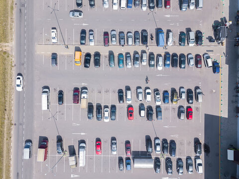 Drone view of a large car parking lot on a sunny summer day vertical car parking