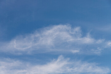 blue sky with diffuse clouds background