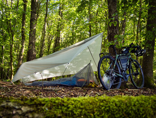 Wild camping in a tent in a forest on a bicycle tour in Germany