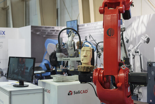 Poznan, Poland 01 Sep 2021: ITM Industry Europe, high-tech EXPO. Close-up COMAU Robot arm in technology process, automatic industrial robot.