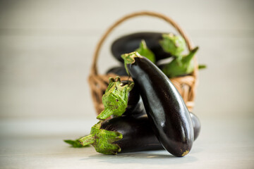 ripe purple eggplant on a wooden background