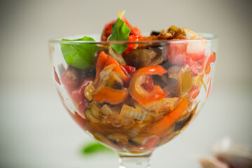 fried eggplants with peppers, tomatoes, onions and garlic