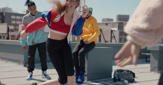 funny woman dancing with friends on rooftop at dance party enjoying crazy celebration girl performing fun dance moves