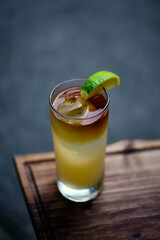 Fresh dark rum cocktail drink with lime