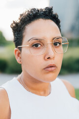 Young multiethnic woman outdoor looking serious and determined