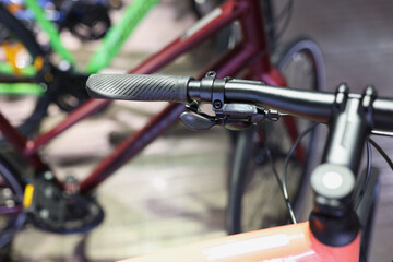 Fototapeta premium Closeup of hand brake on handlebar of bicycle in workshop