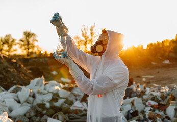 Close-up scientist examining sampling of toxic chemicals on polluted ground