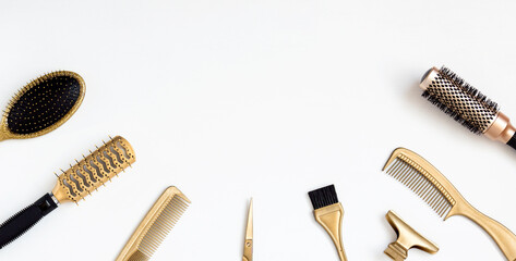 Golden hairdresser tools on a white background, scissors, comb, clip, brush. Hair salon...