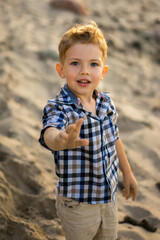 Close up portrait of toddler boy at the beach. summer vacation