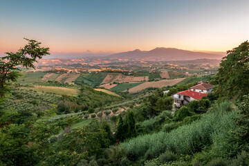 Beautiful sunset on the countryside of Marche in a summer evening