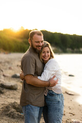 Middle aged couple hugging in the seaside. Summer vacation