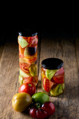 Tinned tomatoes on glass jar