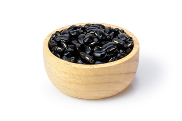 Black beans in wooden bowl and scoop isolated on white background. 