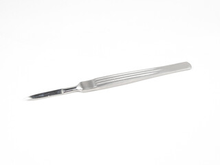 the steel medical scalpel on a white background