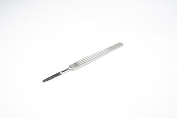 the steel medical scalpel on a white background