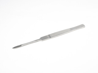 the steel medical scalpel on a white background